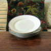 Lot de 4 assiettes plates en porcelaine blanche de Limoges liserés doré et bleu UML France par Hello Broc brocante en ligne