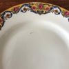 Lot de 4 assiettes à dessert en porcelaine de Limoges bordure jaune et fleurs multicolores par Hello Broc brocante en ligne