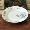 Grand plat rond légèrement creux en porcelaine de Limoges ULIM décor pavots diamètre de 31 cm par Hello Broc brocante en ligne