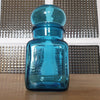 Petit bocal publicitaire pour Ariel en verre moulé bleu par Hello Broc brocante en ligne