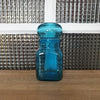 Petit bocal publicitaire pour Ariel en verre moulé bleu par Hello Broc brocante en ligne